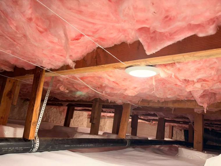 Forest Fresh insulation crew working in a Portland crawl space